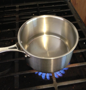 Conduction occurs when heat is transferred directly from the stove's molecules to the pan's molecule. Eventually thermal equilibrium will be reached.  