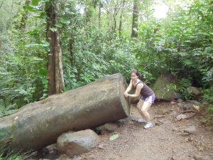 My sister posing with the decaying tree trunk  